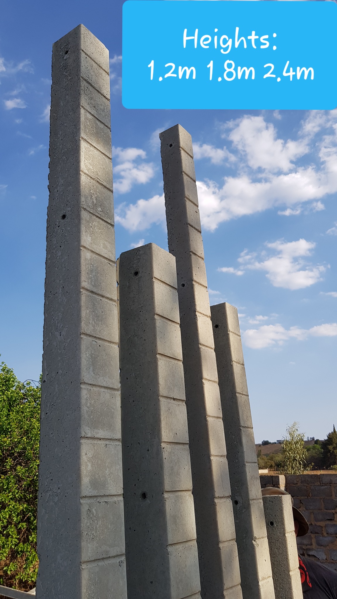 Two plastic water storage tanks in front of a residential property, supplied and installed by Deep End Plumbing.